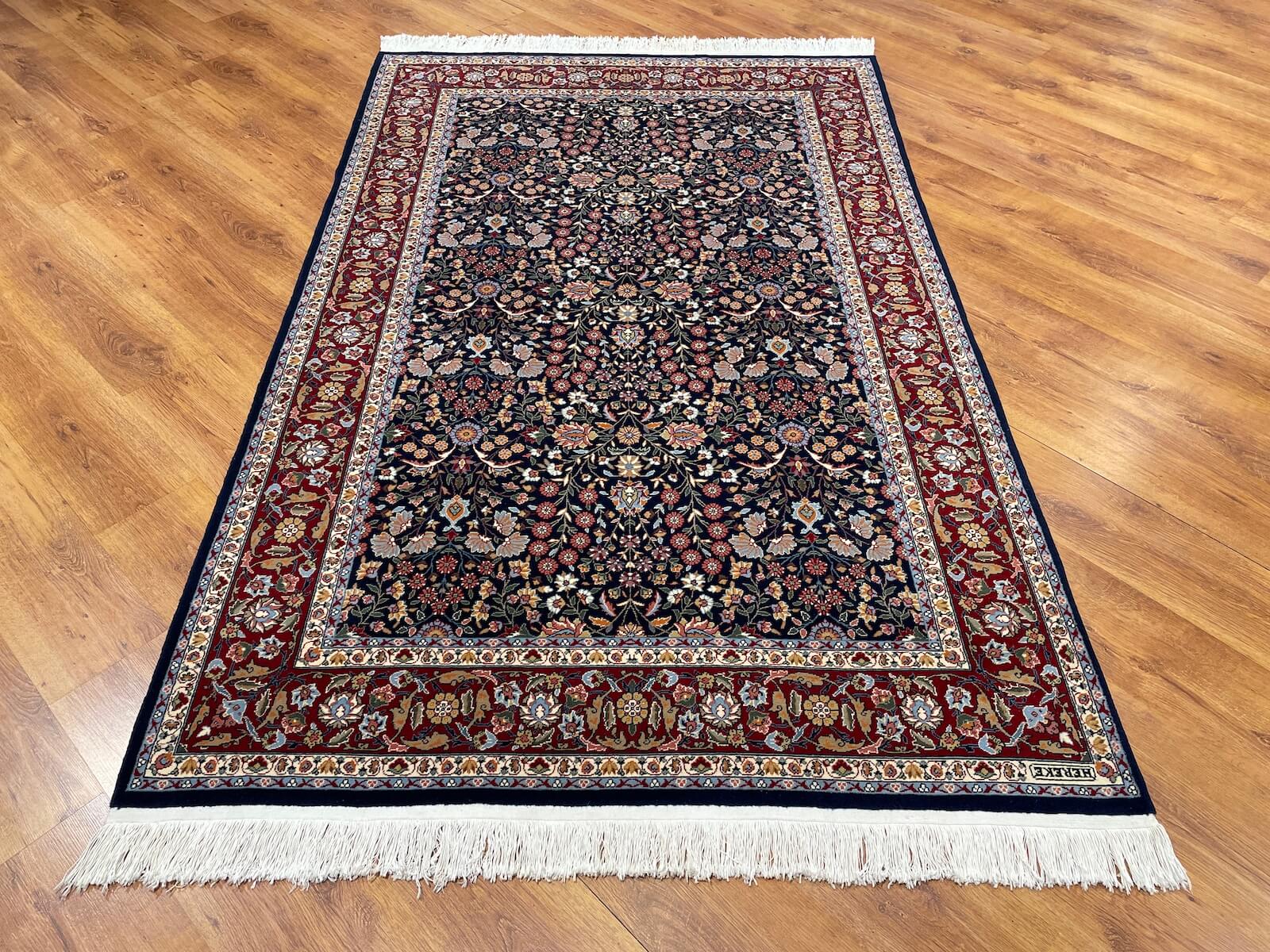 Hereke Yedidagin Cicegi Patterned Navy Handwoven Rug by Camel Carpet