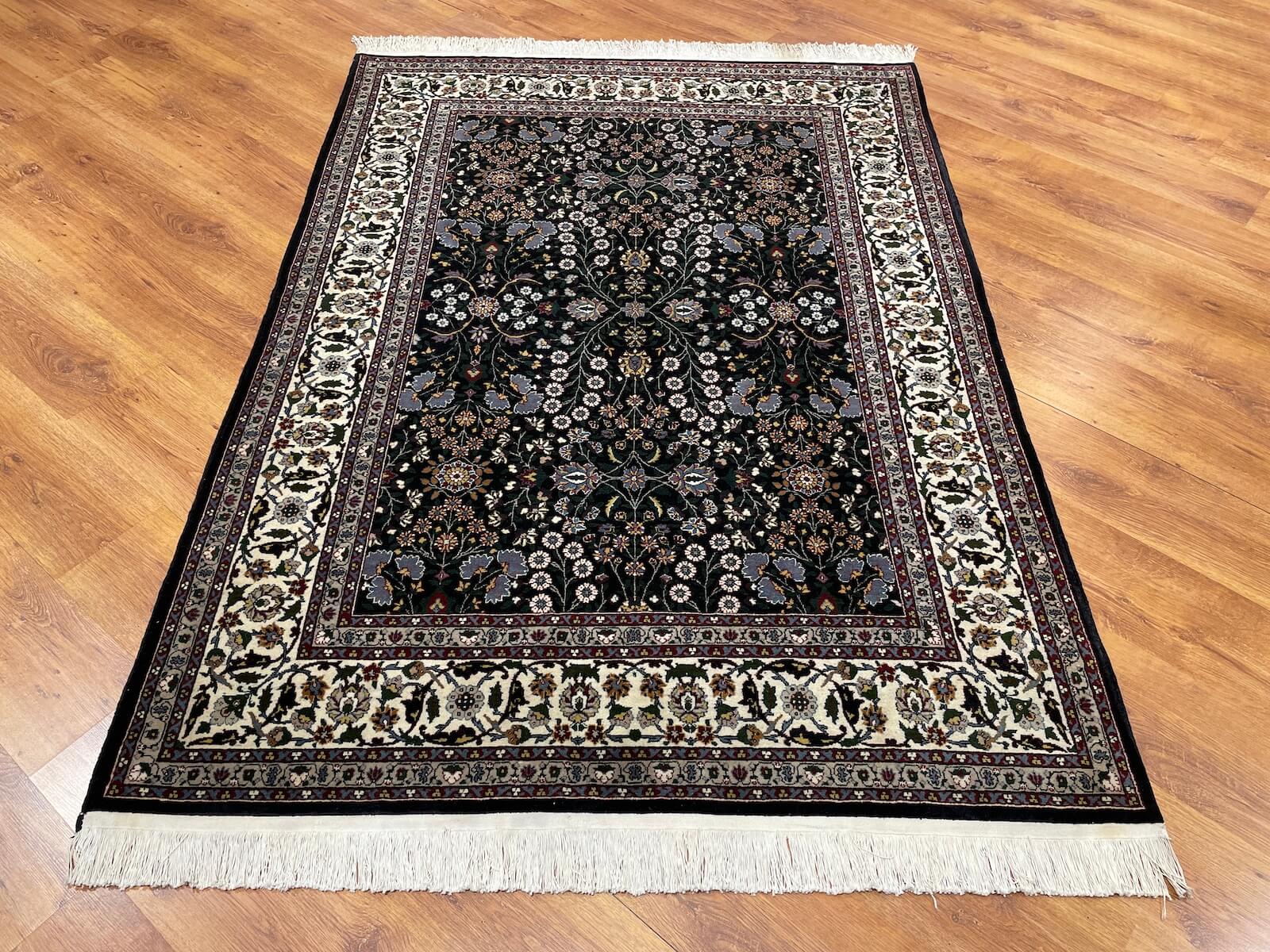 Hereke Yedidagin Cicegi Patterned Black Handwoven Rug by Camel Carpet