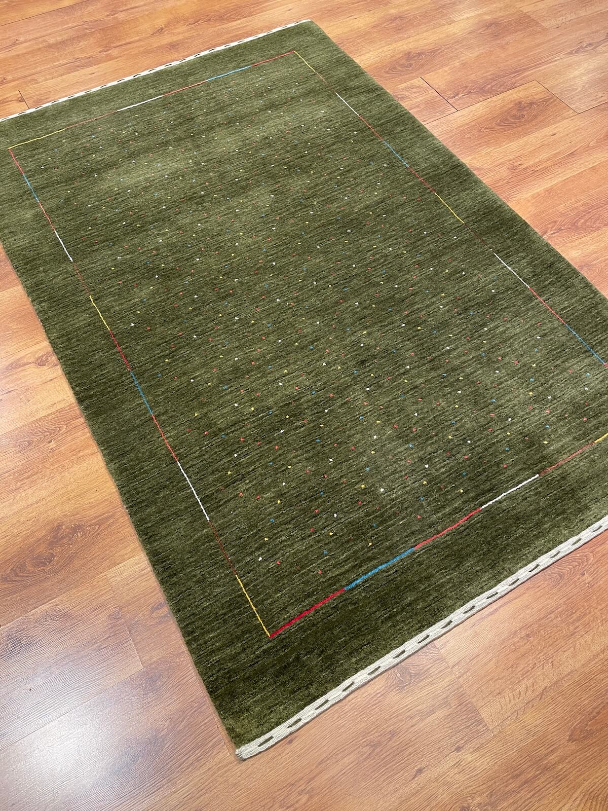 Lori Handwoven Green Wool Rug by Camel Carpet