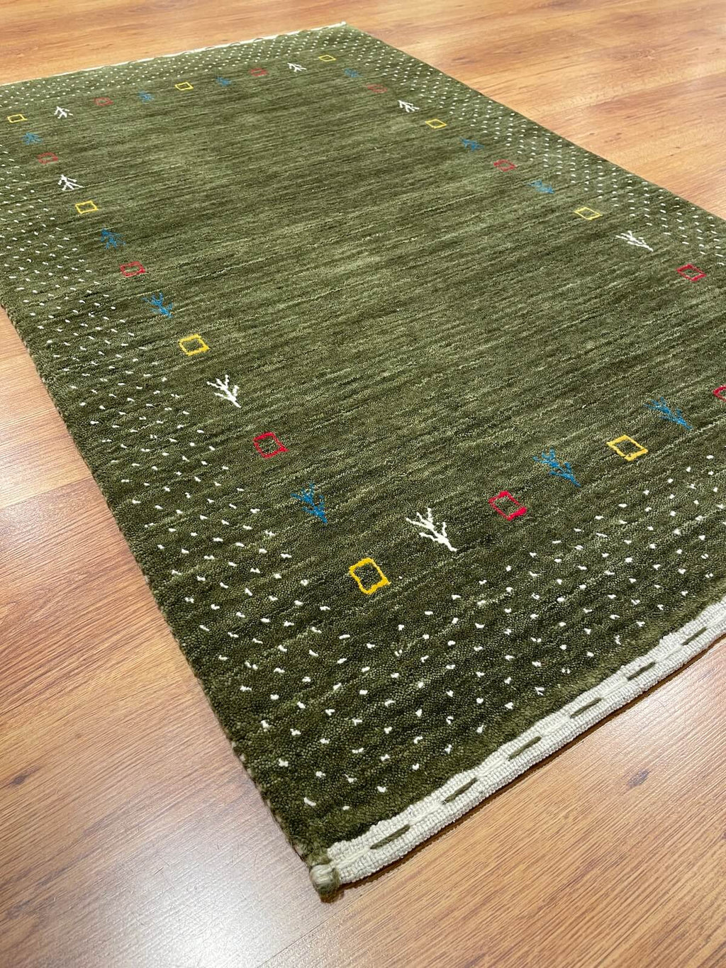 Lori Handwoven Green Wool Rug by Camel Carpet