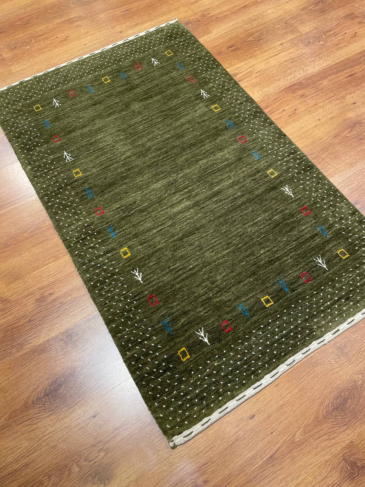 Lori Handwoven Green Wool Rug by Camel Carpet