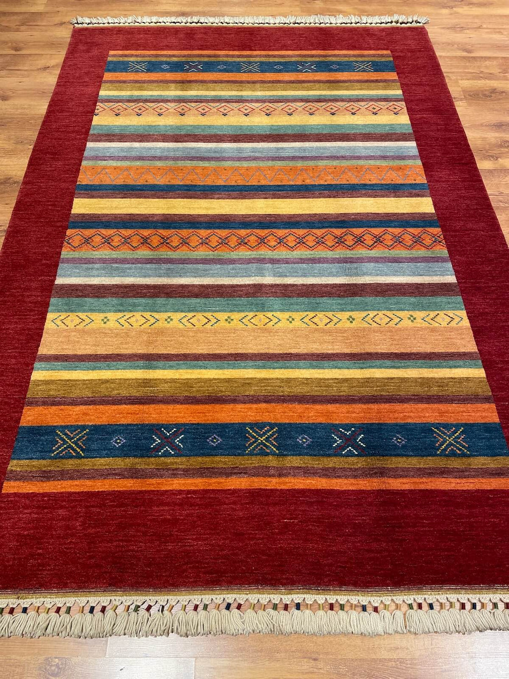 Tribal Handwoven Red Wool Rug – 168X242 by Camel Carpet